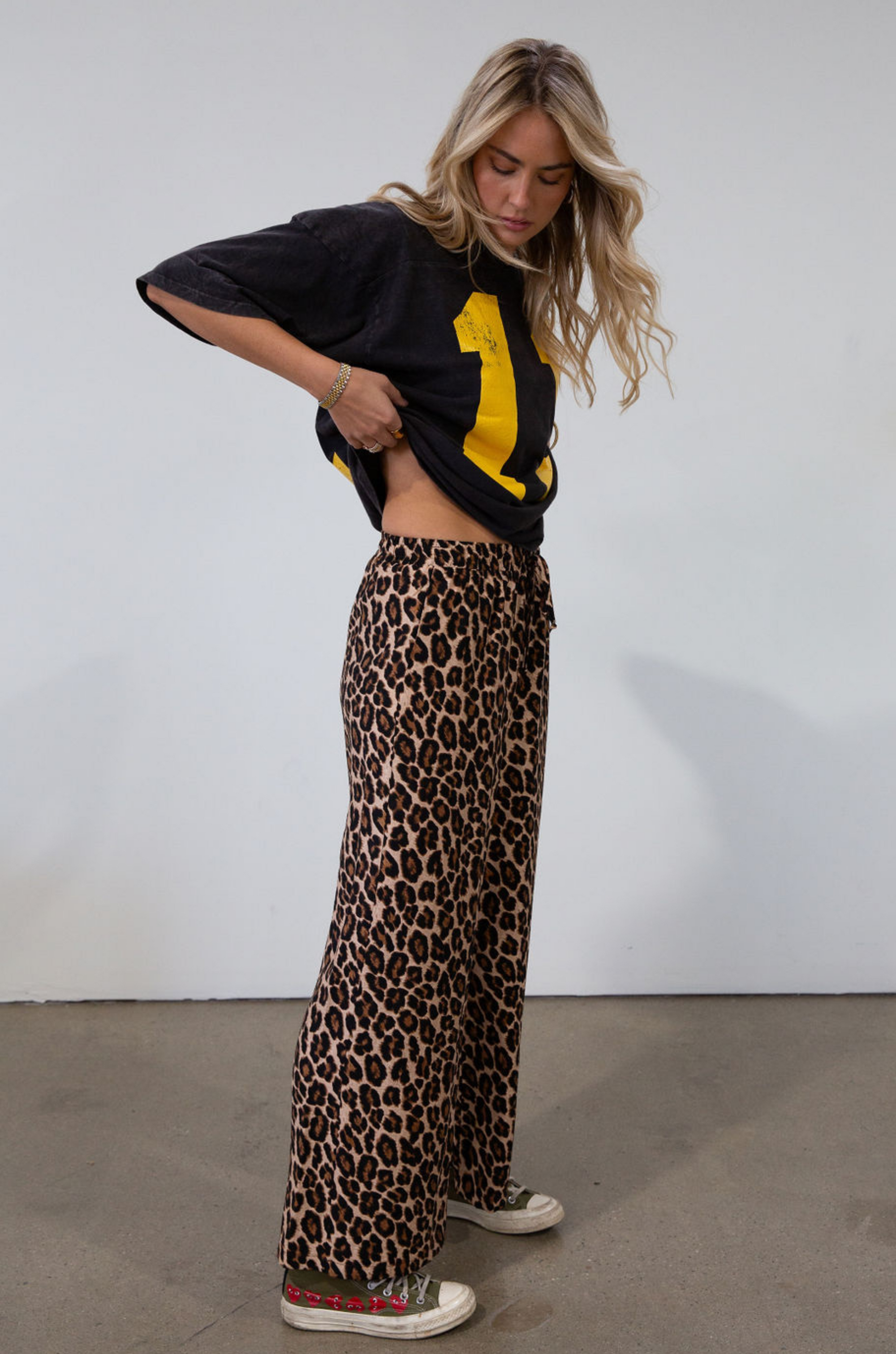 Animal printed woven pants. Elastic waistband with drawstring closure. Unlined.