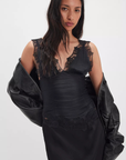 Ruched satin bodice tank top
Smocked backing
Lace trim throughout
V-neckline
Triangle cups
Full length
Asymmetrical hem
black satin lace tank top
free people tank top