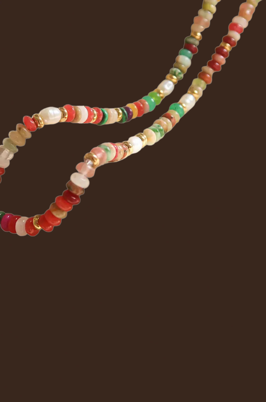 Multicolored beaded necklace on a dark background
colorful necklace