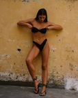 Knit bikini bottom
V shaped
Thong back
Crafted to be worn high on the hips
Glossy texture
Gathered sides meet in a plunge creating a stunning silhouette
black thong bikini bottom