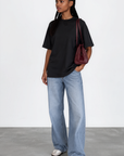 The fabric feels luxuriously soft and smooth against the skin, offering a breathable, lightweight comfort
Relaxed crew neckline
Cuffed sleeves
Length: 29.5"
50% cotton/50% modal butter jersey knit
black oversized basic tshirt top