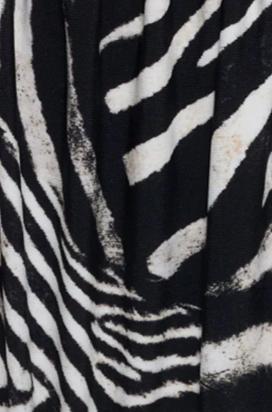 Zebra printed bikini triangle top
Adjustable over the shoulder straps
Adjustable tunneling at underbust
Adjustable ties at back underbust
Fully lined