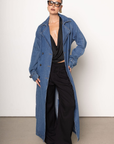 Denim long line trench coat
Adjustable and removable belt
Double breasted button down closure
Unlined
blue denim trench coat