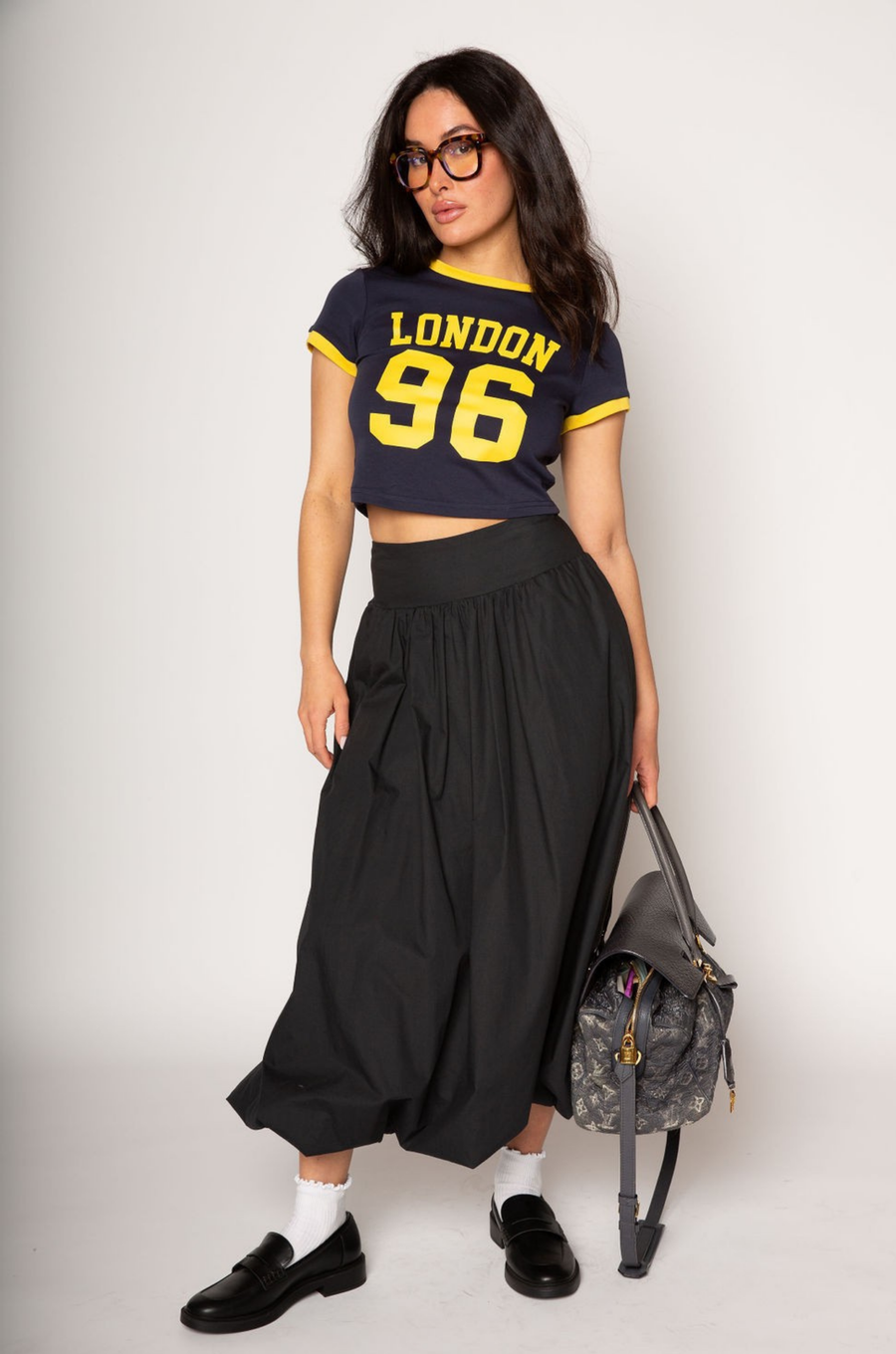 Graphic printed knit crop ringer tee. Crewneck. Short sleeves. Unlined. london graphic tee. baby crop tee