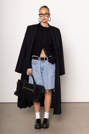 Black knit cardigan. Long sleeves. Front button down closure. Banded hems. Unlined. fall top. fall outfit. holiday outfit.