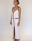 cream Crochet knit maxi dress. Sleeveless. V-neckline. Front button down closures. Faux front pockets. Unlined. cream knit maxi dress. knit button down maxi dress
