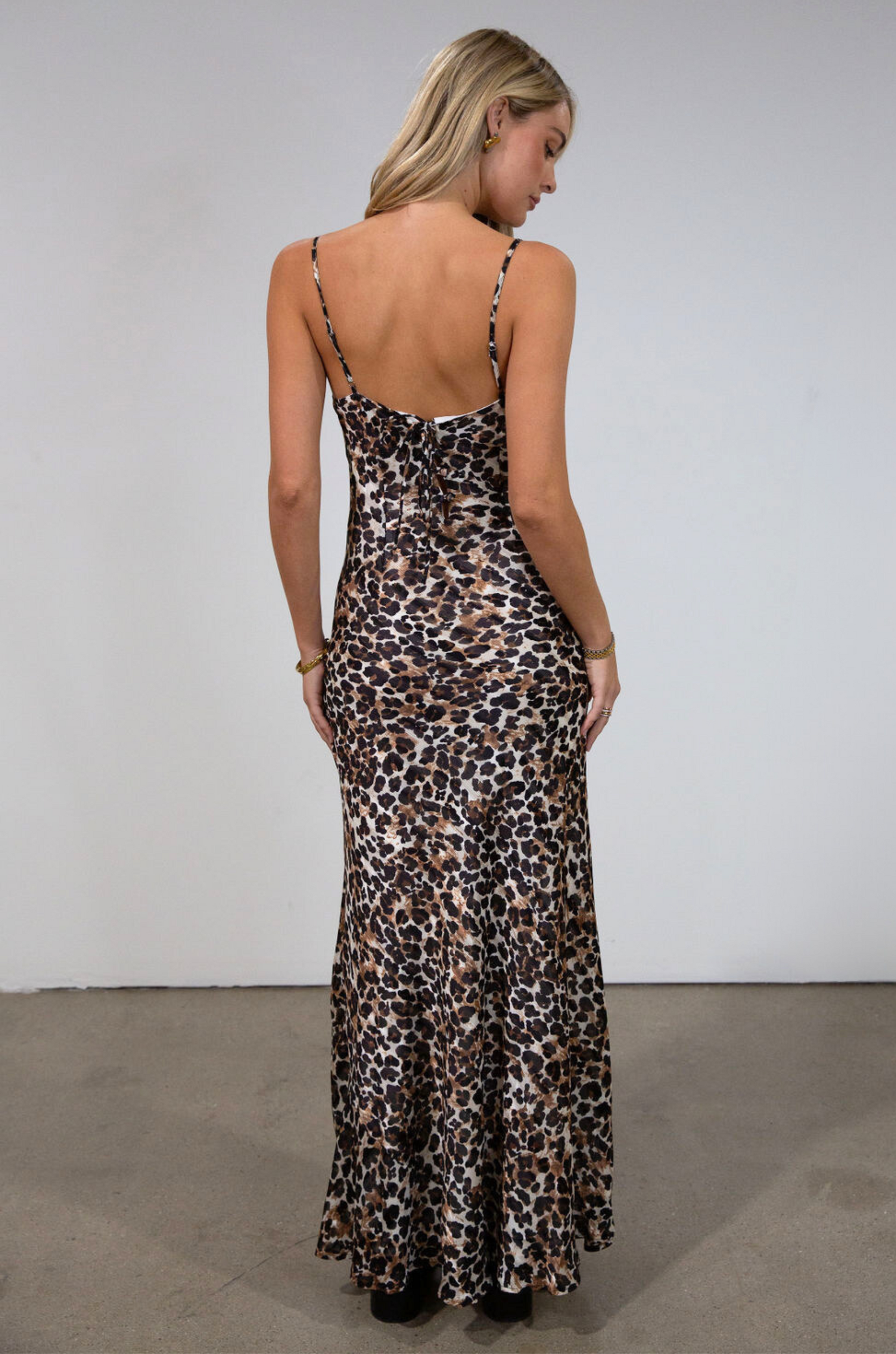 Animal printed chiffon maxi dress. Adjustable straps. Side hook and eye and zipper closures. Back tie and button closures. Fully lined. leopard maxi dress. fall maxi dress