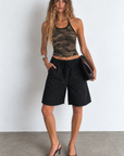 Camo printed halter top
Fixed halter neck
Unlined