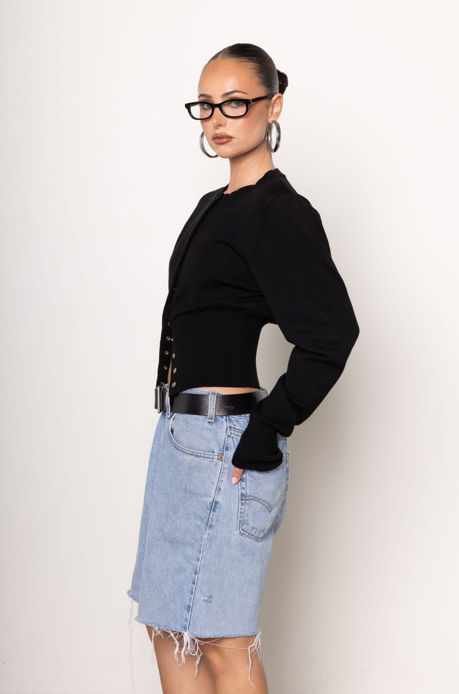 Black knit cardigan. Long sleeves. Front button down closure. Banded hems. Unlined. fall top. fall outfit. holiday outfit.