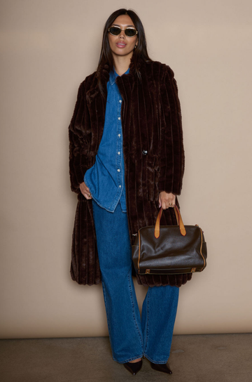 Faux fur longline coat. Collar neckline. Front button closures. Front pockets. Back slit. Fully lined. brown long fur coat. fall coat. winter coat. layering piece. 