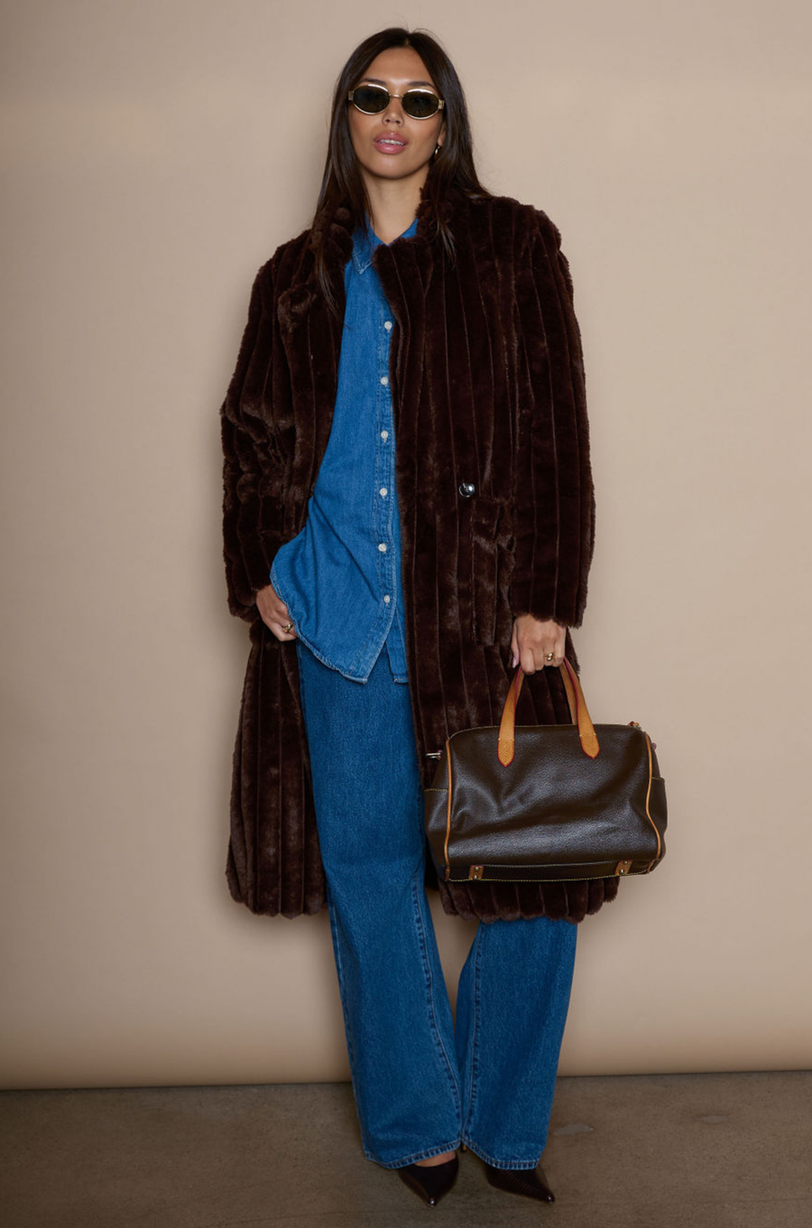 Faux fur longline coat. Collar neckline. Front button closures. Front pockets. Back slit. Fully lined. brown long fur coat. fall coat. winter coat. layering piece. 