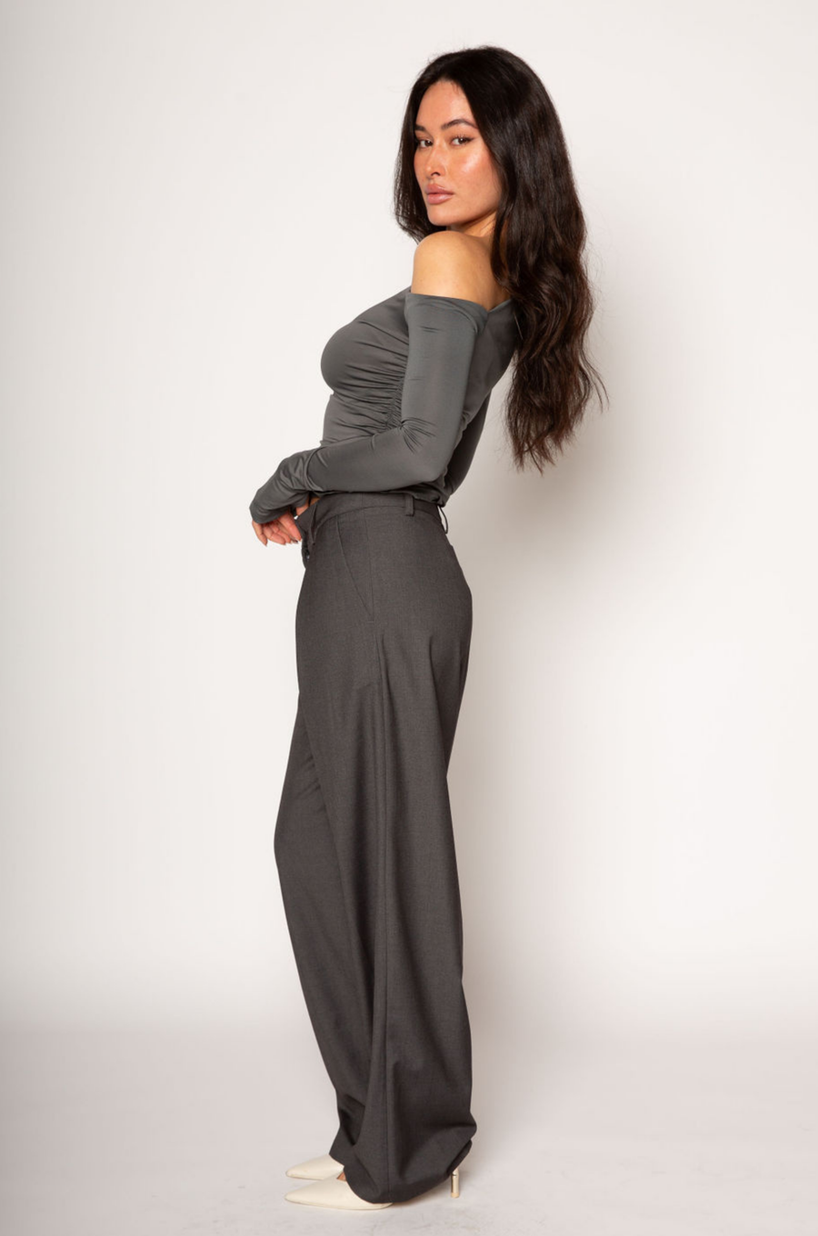 Grey woven trouser pants. Button and zipper fly. Side pockets. Faux back pocket. Unlined. Grey work slack