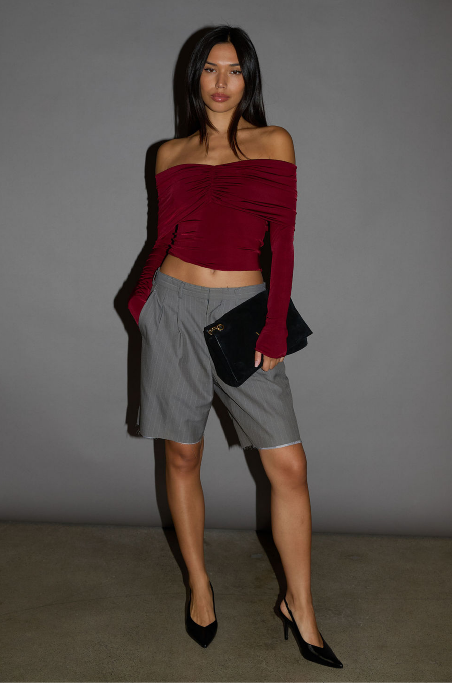 Knit crop top. Strapless elastic folded neckline. Front and back ruching. Long sleeves. Unlined. red off the shoulder long sleeve top. burgundy off the shoulder long sleeve top. holiday outfit. holiday look. christmas top. christmas outfit