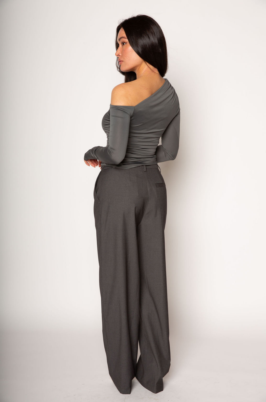 Grey woven trouser pants. Button and zipper fly. Side pockets. Faux back pocket. Unlined. Grey work slack