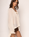 cream beige Sheer chiffon long sleeve top
Ruffle trim
Tie front
Sleeve adjustbale tie
Unlined/sheer
boho ruffle long sleeve top