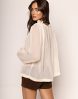 cream beige Sheer chiffon long sleeve top
Ruffle trim
Tie front
Sleeve adjustbale tie
Unlined/sheer
boho ruffle long sleeve top