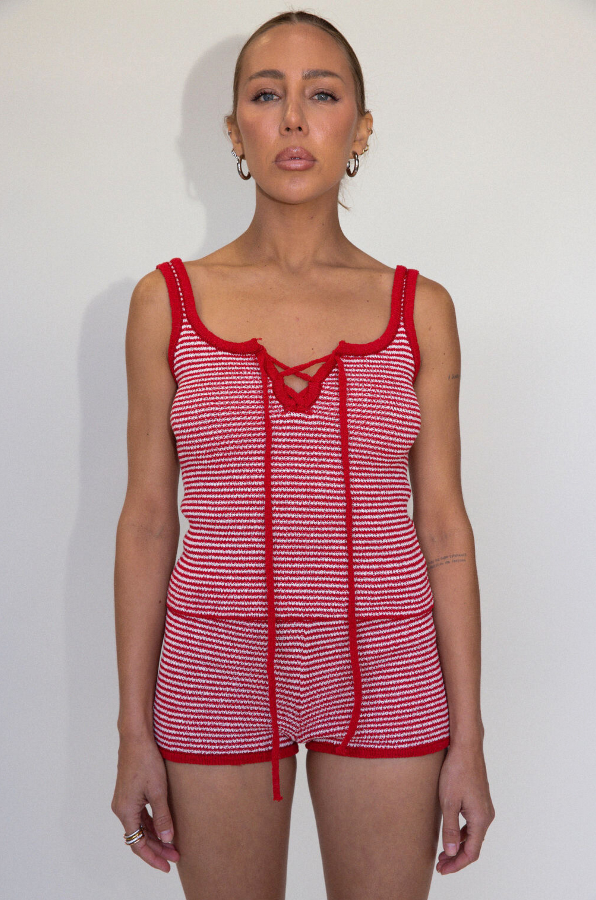 red and white Striped knit tank top
Fixed Straps
Front lace up tie
Raw edge
Unlined
summer top