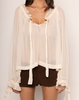 cream beige Sheer chiffon long sleeve top
Ruffle trim
Tie front
Sleeve adjustbale tie
Unlined/sheer
boho ruffle long sleeve top