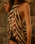 Printed flowy halter top
Asymmetrical hem
Adjustable neck tie
resort wear
resort vacation outfit