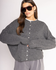 Fuzzy knit cardigan
Crewneck
Front button down closures
Long sleeves
Dark grey cardigan
Charcoal grey cardigan