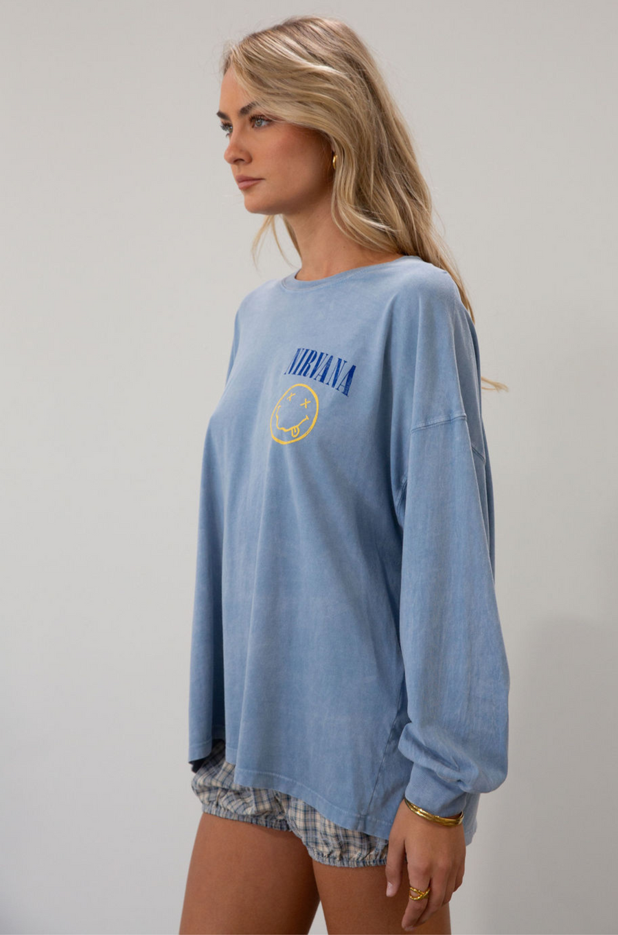 blue Graphic printed acid wash knit top. Crewneck. Long sleeves. Unlined.
