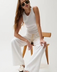 Cut to sit low on the hips
Relaxed rise
Easy adjustable drawstring waist tie
Wide, fluid leg
Constructed from non-stretch denim
Size 26 measurements:
Rise: 11" / Inseam: 32 1/2" / Leg Opening: 24"
Cotton/Lyocell
white denim jeans