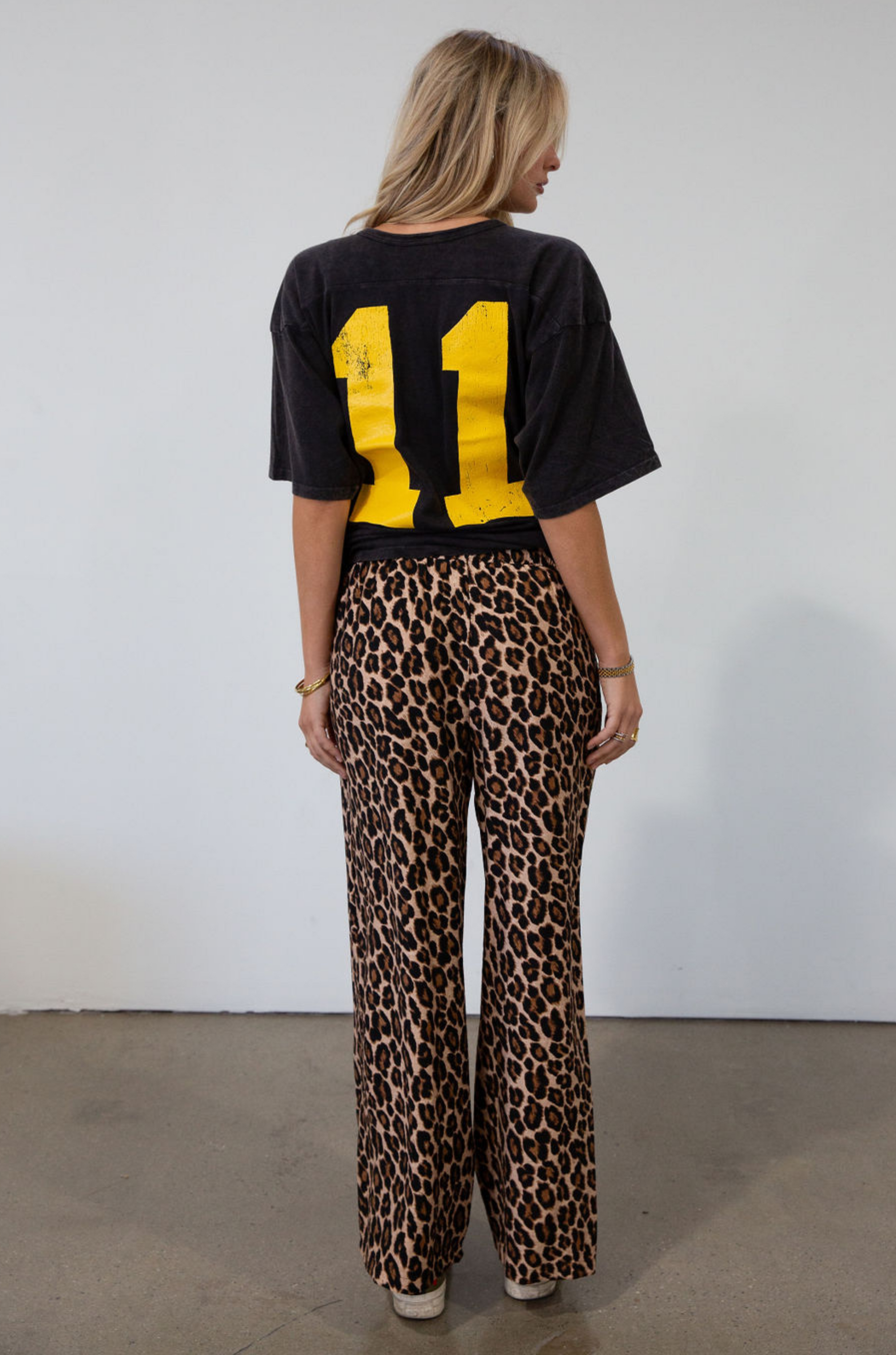 Animal printed woven pants. Elastic waistband with drawstring closure. Unlined.