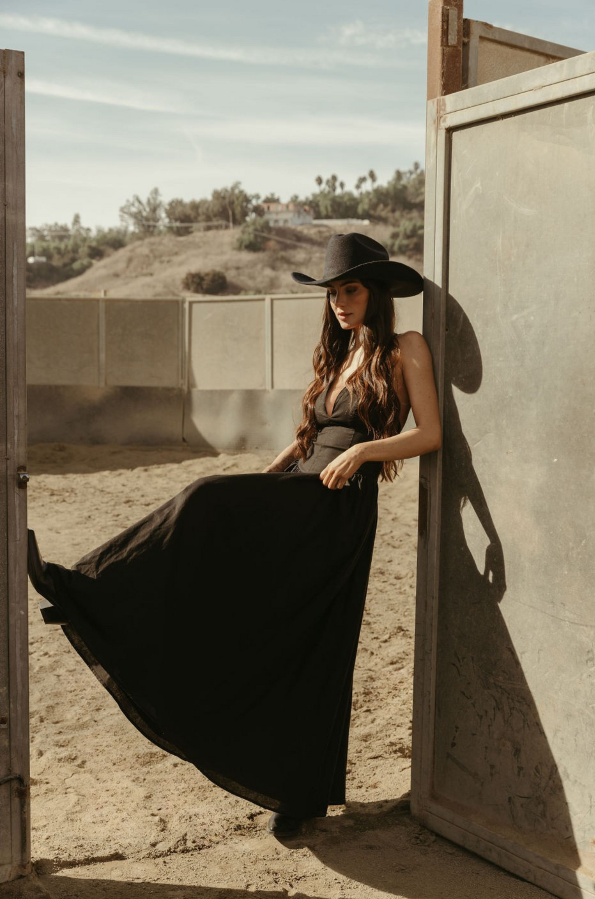 Woven maxi dress. Adjustable crisscross back straps. Back hook and eye and zipper closures. Fully lined. black maxi dress. country outfit. country dress. western outfit. western dress.