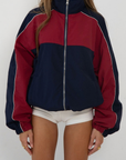 red and blue Windbreaker track jacket
Reversible into plaid
Lined
Zipper closure
Funnel neck
fall transition outfit