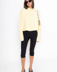 Fuzzy knit cardigan
Crewneck
Front button down closures
Long sleeves
Unlined
yellow cardigan