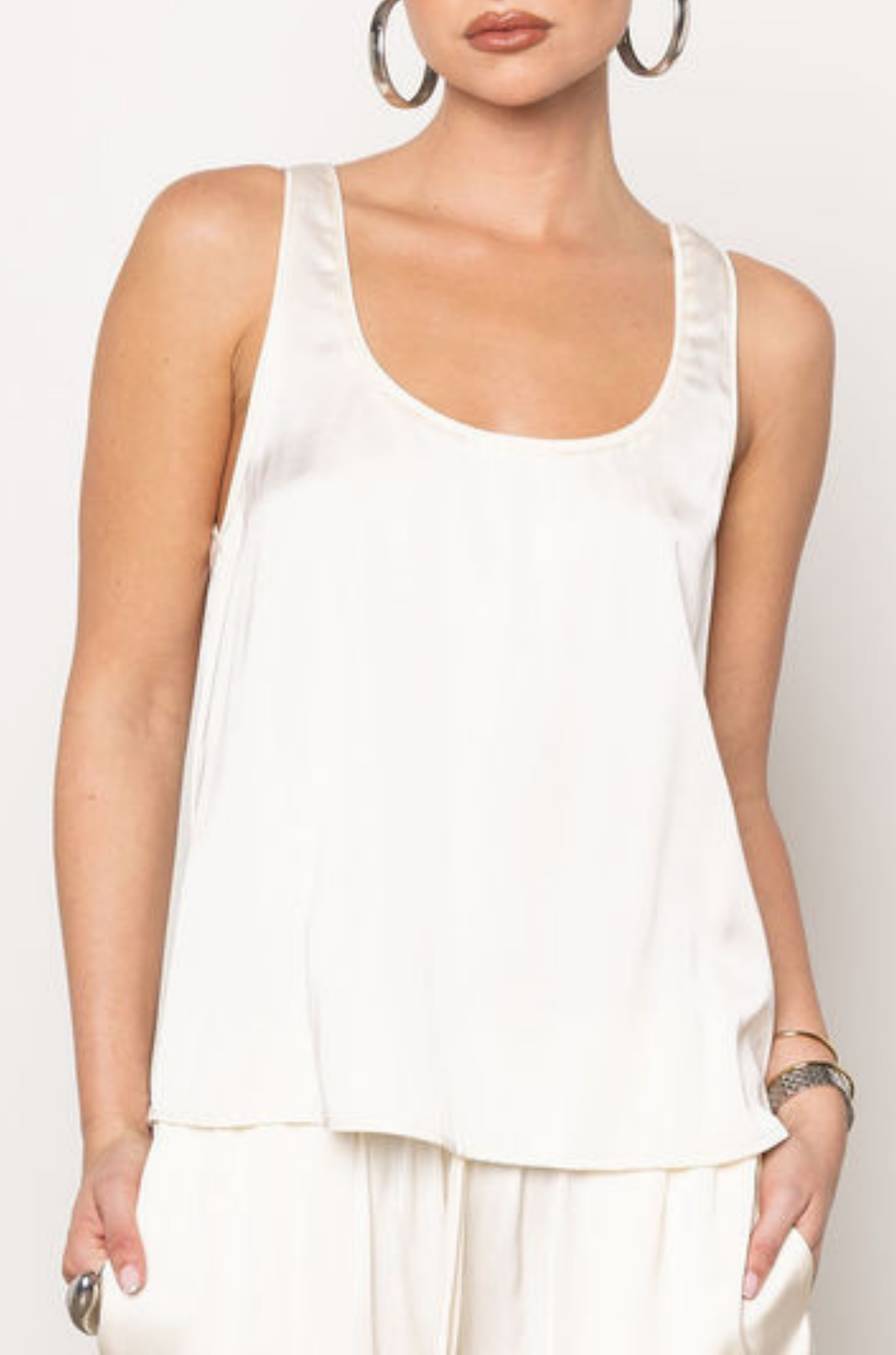 cream ivory Satin tank top
Sleeveless
U neckline
Unlined
Length: 22.5"
Polyester/Rayon