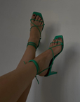 Newly designed in an electrifying neon shade. Inspired by a classic feminine silhouette, the Bellini sandals represent the ultimate combination of glamour and comfort. Crafted in soft leather, this lace-up style wraps around the ankle in a barely there delicate sandal that is perfect for any special occasion. green strappy heel