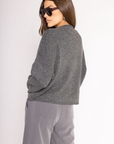 Fuzzy knit cardigan
Crewneck
Front button down closures
Long sleeves
Dark grey cardigan
Charcoal grey cardigan