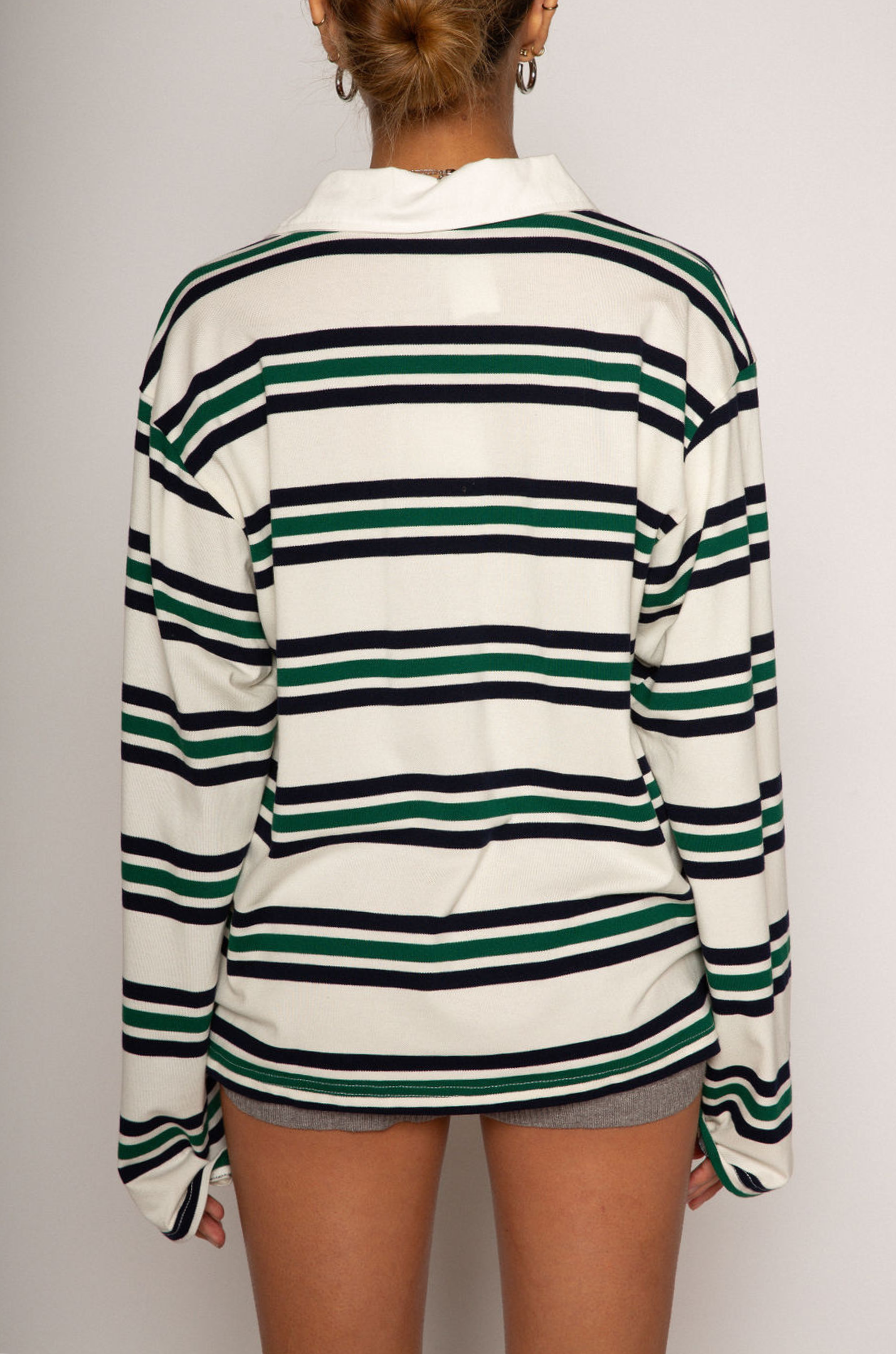 Striped knit top. Collar neckline. Front button closures. Long sleeves. Unlined. striped polo long sleeve. fall top. fall outfit