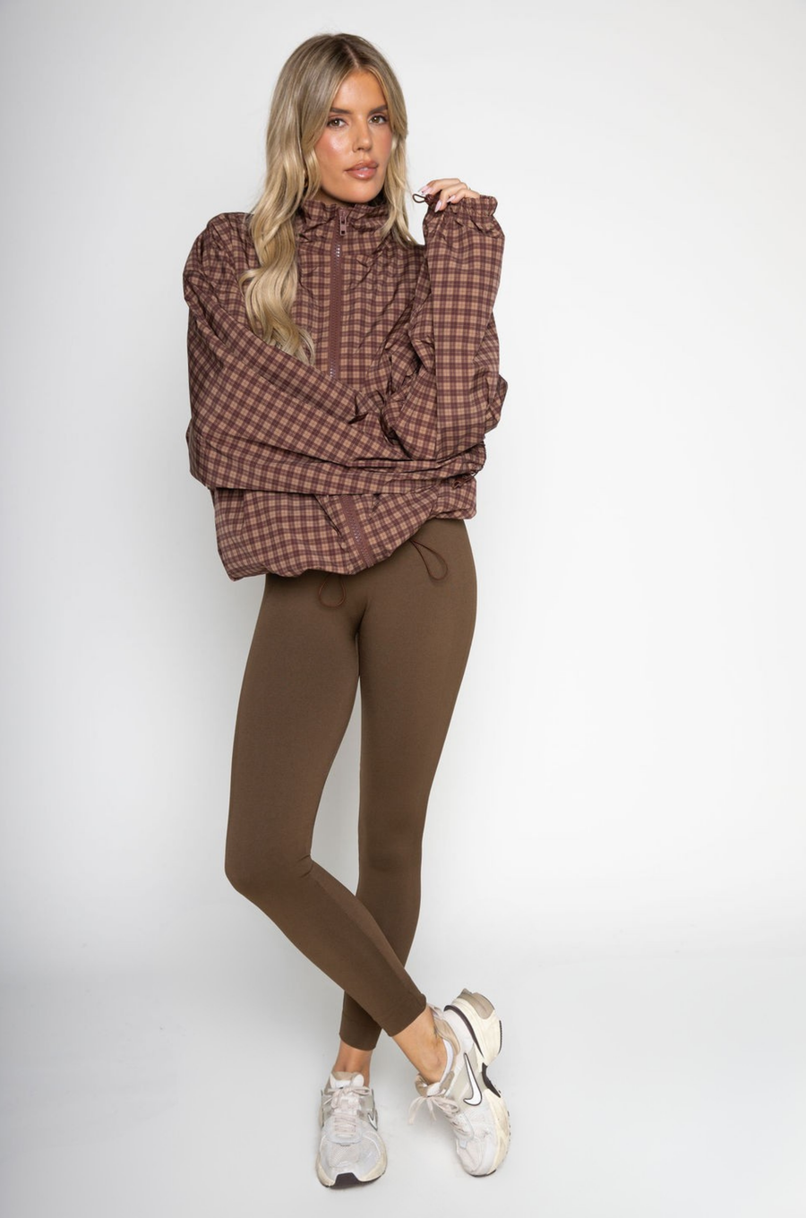 brown Gingham printed windbreaker jacket
Front zipper closure
Adjustable cinch-able hem and arm hem
Side pockets
Partial inner mesh lining
fall windbreaker
cute windbreaker
fall workout outfit