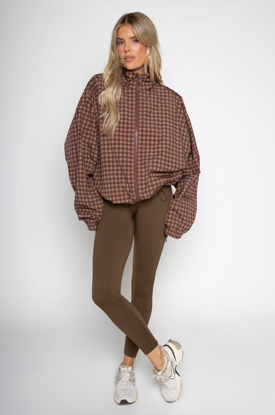 brown Gingham printed windbreaker jacket
Front zipper closure
Adjustable cinch-able hem and arm hem
Side pockets
Partial inner mesh lining
fall windbreaker
cute windbreaker
fall workout outfit