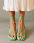 Newly designed in an electrifying neon shade. Inspired by a classic feminine silhouette, the Bellini sandals represent the ultimate combination of glamour and comfort. Crafted in soft leather, this lace-up style wraps around the ankle in a barely there delicate sandal that is perfect for any special occasion. green strappy heel