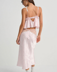 Pink satin sleep lingerie top
Open-front satin cami tank top
Sleek floral jacquard,
Adorned with lace trims, decorative bows, and a rosette at the center-front
Adjustable shoulder straps
Hook and eye closure at center-back
Unlined
Polyester/Elastane