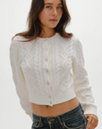 white Cable knit cardigan sweater
Snug feel with a slightly cropped fit
Crafted with custom Frankies Bikinis buttons
Ribbed detailing on hem, sleeve openings, and neckline
Cotton
fall sweater
fall cardigan
fall outfit