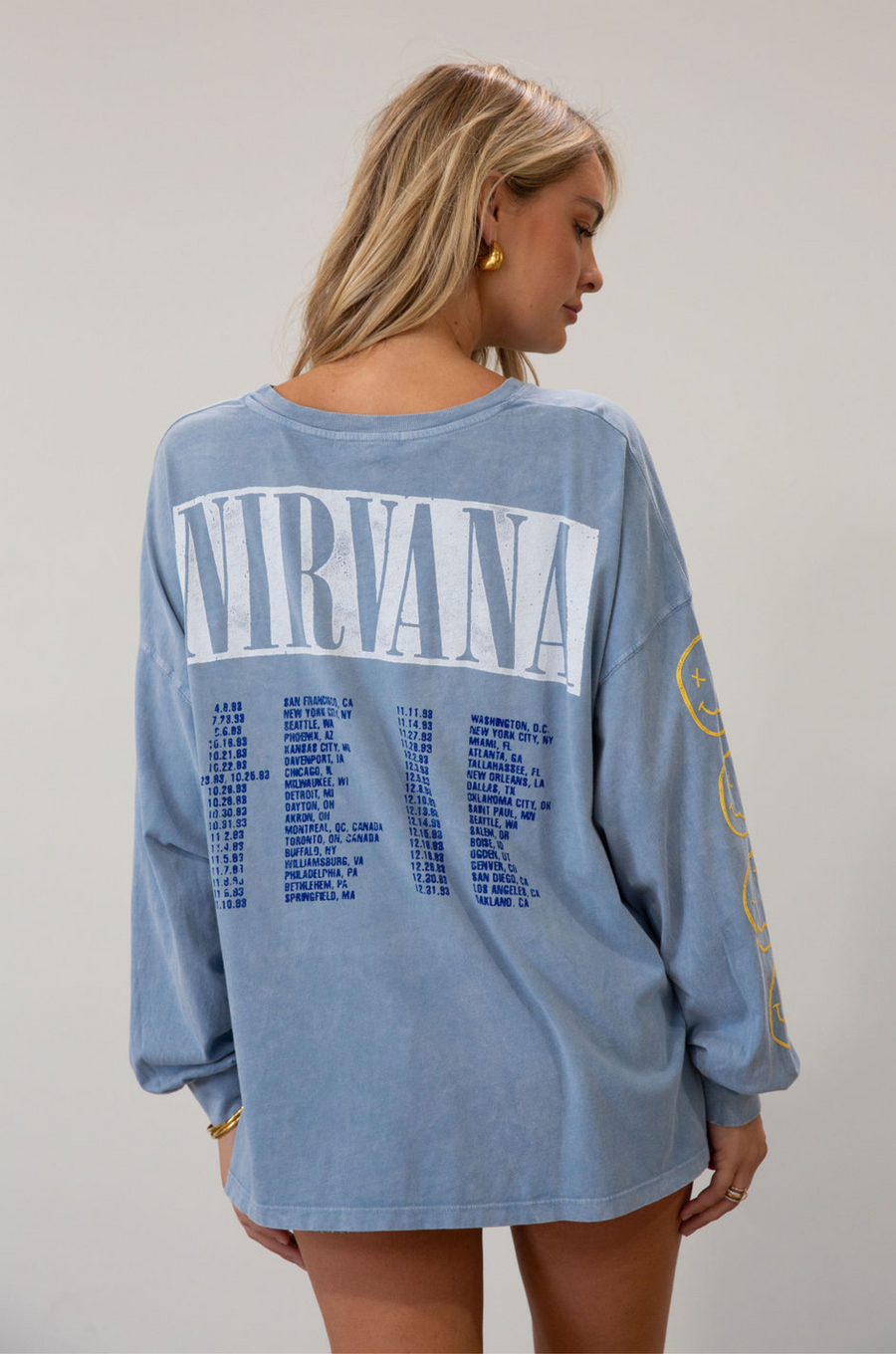 blue Graphic printed acid wash knit top. Crewneck. Long sleeves. Unlined.