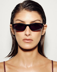 black Sleek, 90s-inspired essential sunglasses. Defined by their slimline rectangle silhouette, this modern style is elevated with gold metal tips on the arms for a refined, polished finish.

Featuring:
slimline rectangle silhouette
90s inspired design aesthetic
gold metal tip detailing on arms
lightweight frame construction
includes branded case and cleaning cloth
designed in Australia
UV protection | UV400