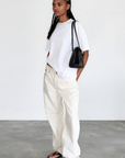The fabric feels luxuriously soft and smooth against the skin, offering a breathable, lightweight comfort
Relaxed crew neckline
Cuffed sleeves
Length: 29.5"
50% cotton/50% modal butter jersey knit
white oversized basic tshirt top
