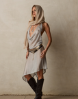 silver Metallic halter top
Cowl neckline
Adjustable neck and back tie
Unlined/Sheer