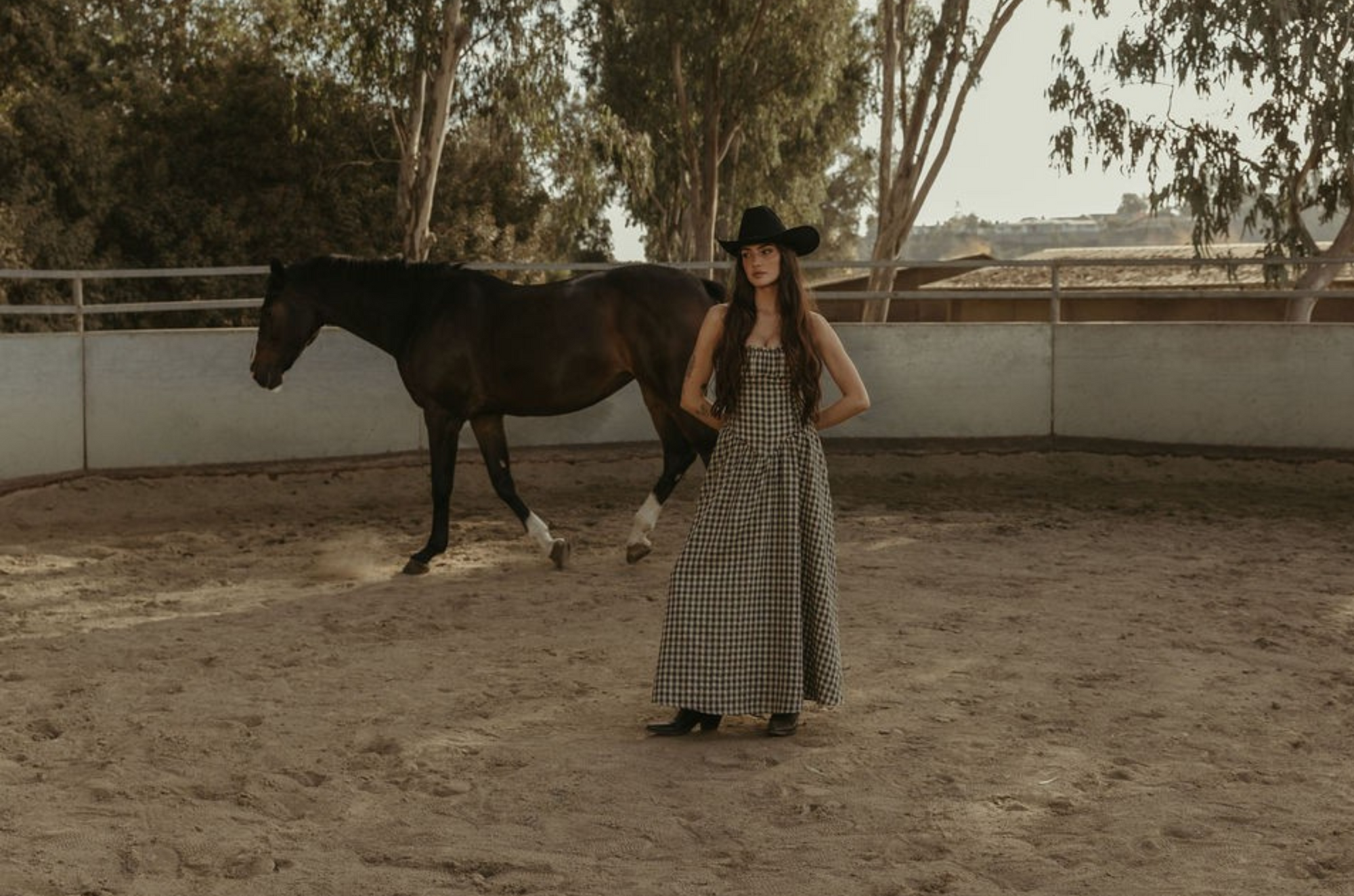 Plaid woven maxi dress. Elastic strapless neckline. Inner rubber grip lining. Elastic smocked back panel. Back hook and eye and zipper closures. Fully lined. Paid maxi dress. ranch outfit. western outfit
