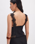 Ruched satin bodice tank top
Smocked backing
Lace trim throughout
V-neckline
Triangle cups
Full length
Asymmetrical hem
black satin lace tank top
free people tank top