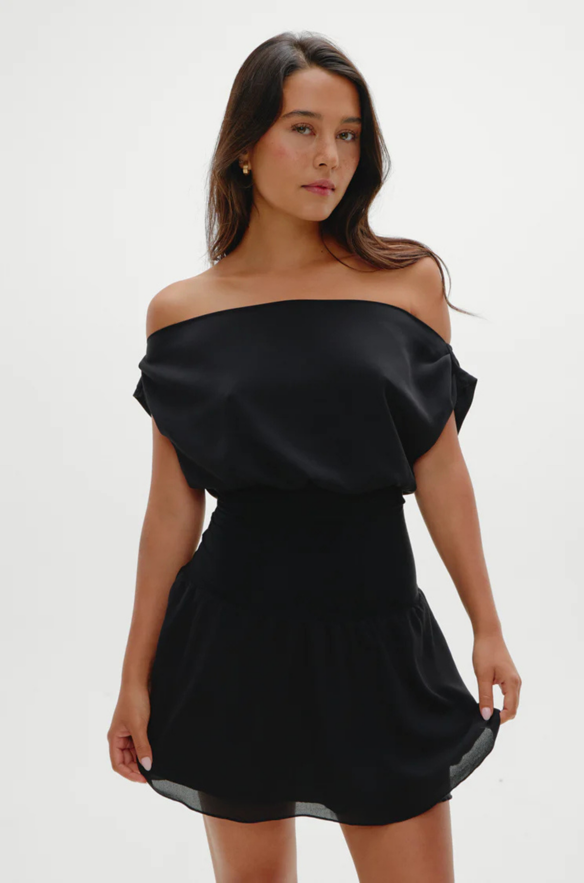 Stretchy knit midsection
Contrasted by lightweight chiffon through the neckline, bodice, and skirt
Wide neckline
Sits naturally as a boat neck and can be styled on or off the shoulders
Double layer skirt
Polyester
black mini dress