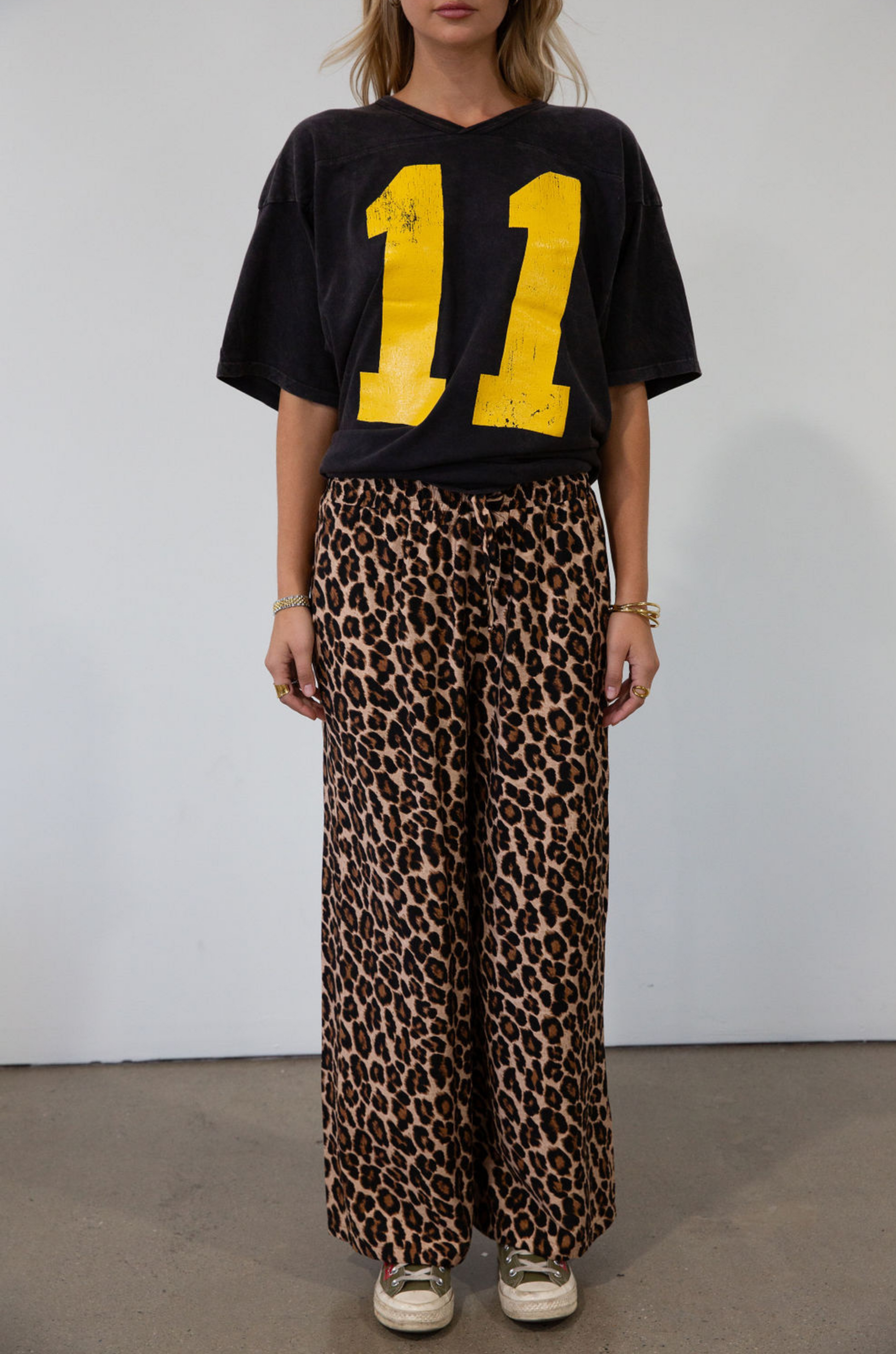 Animal printed woven pants. Elastic waistband with drawstring closure. Unlined.