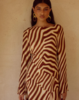 Animal printed long sleeve maxi dress
Front high slit 
Boat neckline
Adjustable back straps 
Open back Back zipper closure 
Lined, non-stretch 
zebra printed maxi dress 
long sleeve maxi dress
