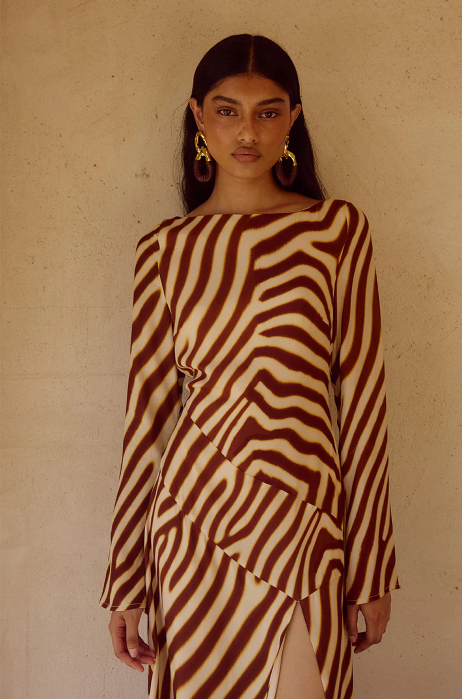 Animal printed long sleeve maxi dress
Front high slit 
Boat neckline
Adjustable back straps 
Open back Back zipper closure 
Lined, non-stretch 
zebra printed maxi dress 
long sleeve maxi dress
