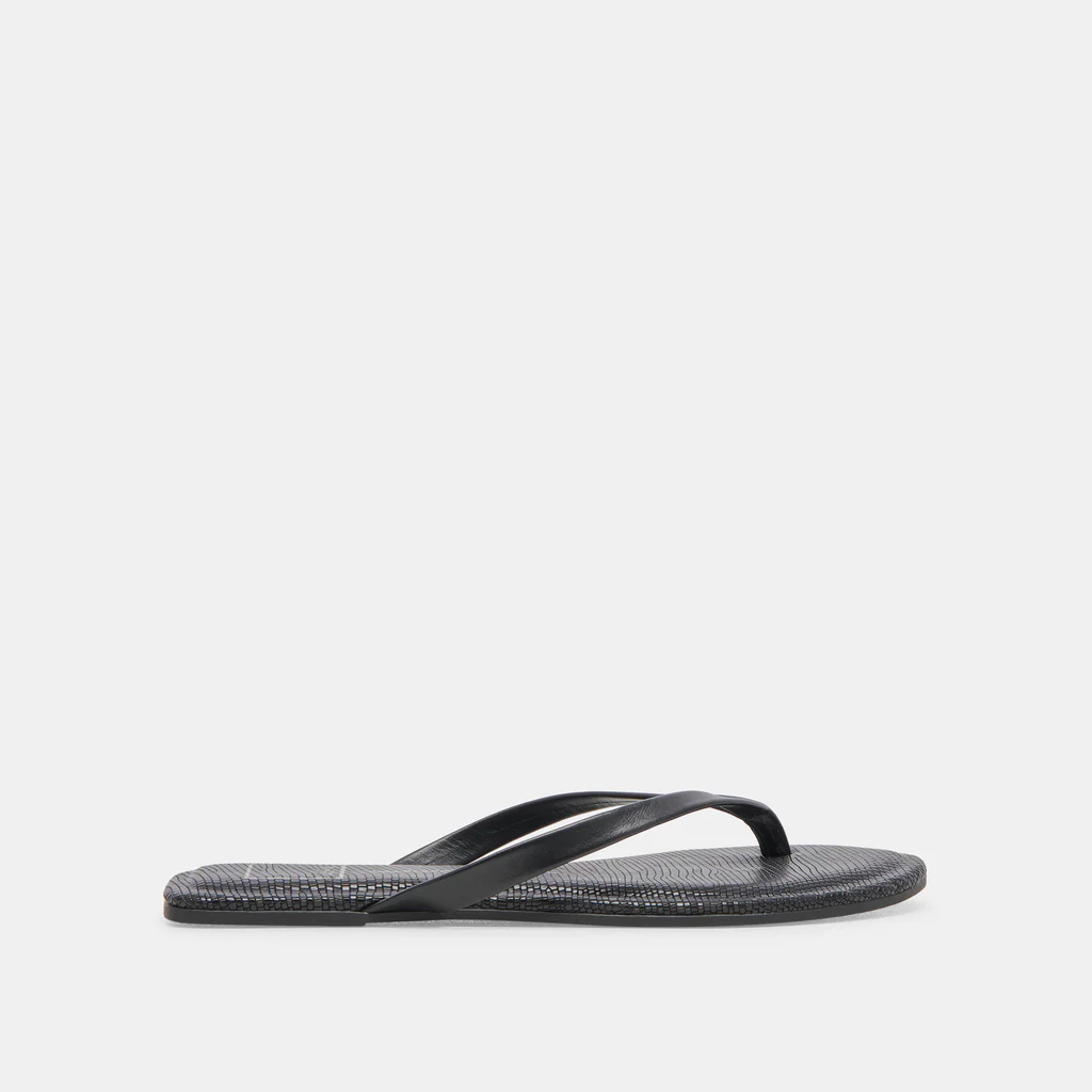 pared down and simplistic sandal adds a chic and effortless touch to your casual looks. Black sandal. Simple but cute sandal. Dolce Vita shoe. Dolce vita sandal. 